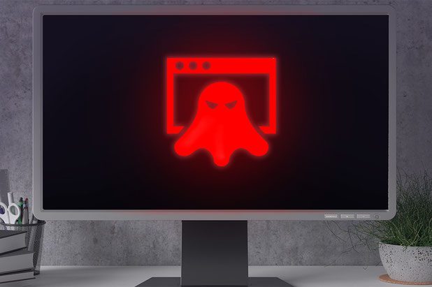 Schädliche Software auf einem PC. Sicht eines rot leuchtenden Icons eines bösen Geistes
